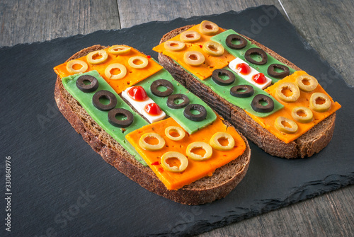 Still life with two cheese sandwiches.