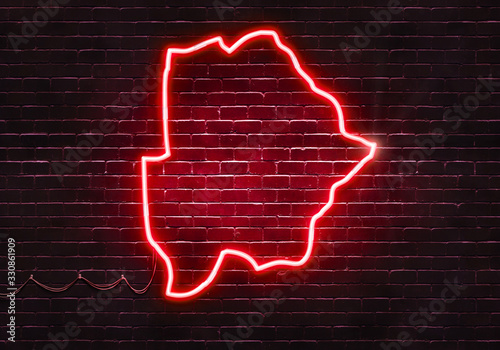 Neon sign on a brick wall in the shape of Botswana.(illustration series)