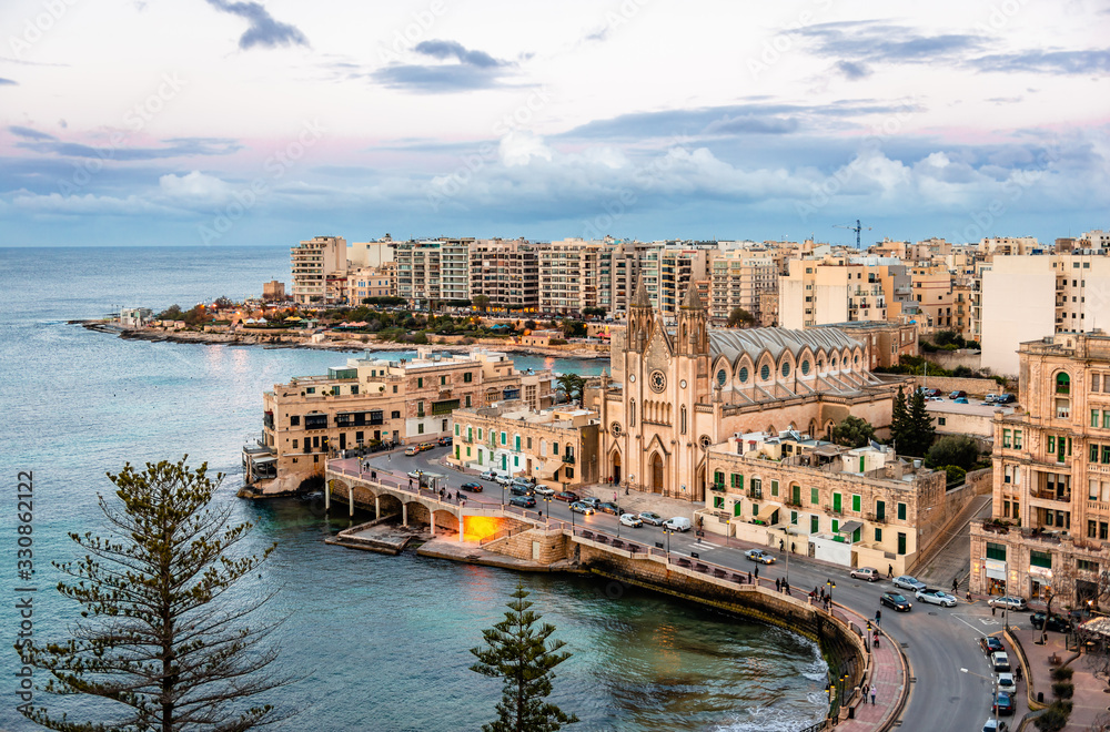Sliema / Malta - February 22, 2015: View of Balluta Bay from the 12th floor of Le Méridien Hotel. The skyline is dominated by the Carmelite Parish Church (Church of Our Lady of Mont Carmel).