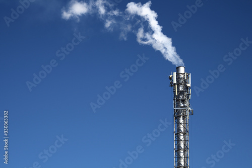 chimney smoke on blue sky carbon dioxide air pollution co2 emission