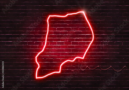 Neon sign on a brick wall in the shape of Uganda.(illustration series)