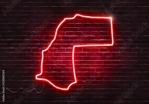 Neon sign on a brick wall in the shape of Western Sahara.(illustration series)