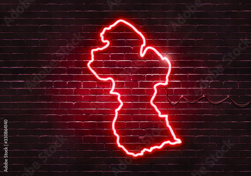 Neon sign on a brick wall in the shape of Guyana.(illustration series)