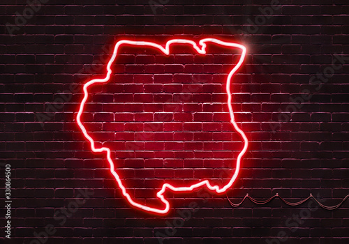 Neon sign on a brick wall in the shape of Suriname.(illustration series)