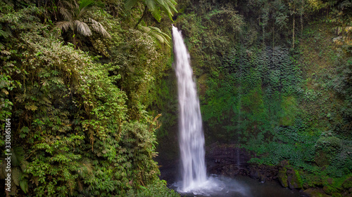 165 foot Nungnung falls in Bali, Indonesia is a spectacular cascading year-round waterfall. © JAMES