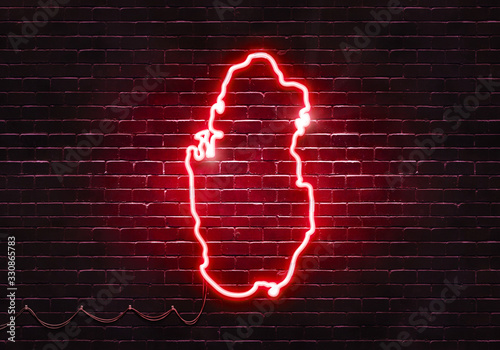 Neon sign on a brick wall in the shape of Qatar.(illustration series)