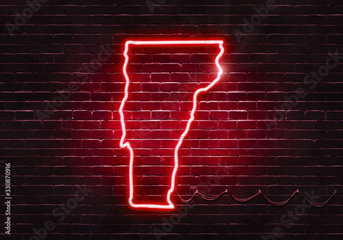 Neon sign on a brick wall in the shape of Vermont.(illustration series)