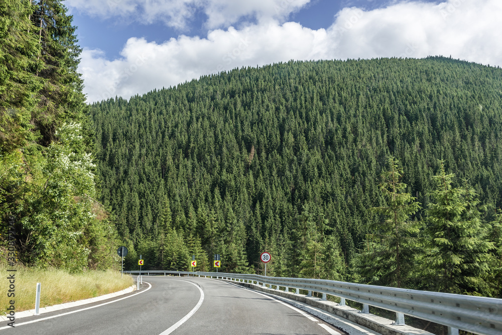 Epmty road near Prislop mountain pass on border of Maramures and Bukovina regions, Romania