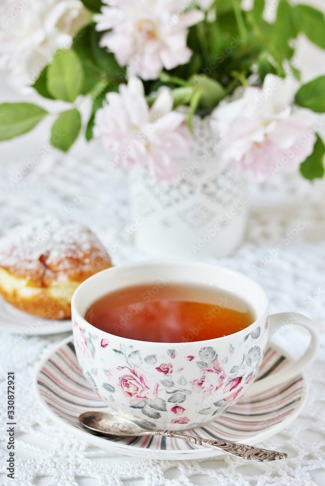 A tea party in the style of Shabby Chic. tea in the beautiful tea steam with a pattern A tea party in the style of Shabby Chic. tea in the beautiful tea steam with a pattern