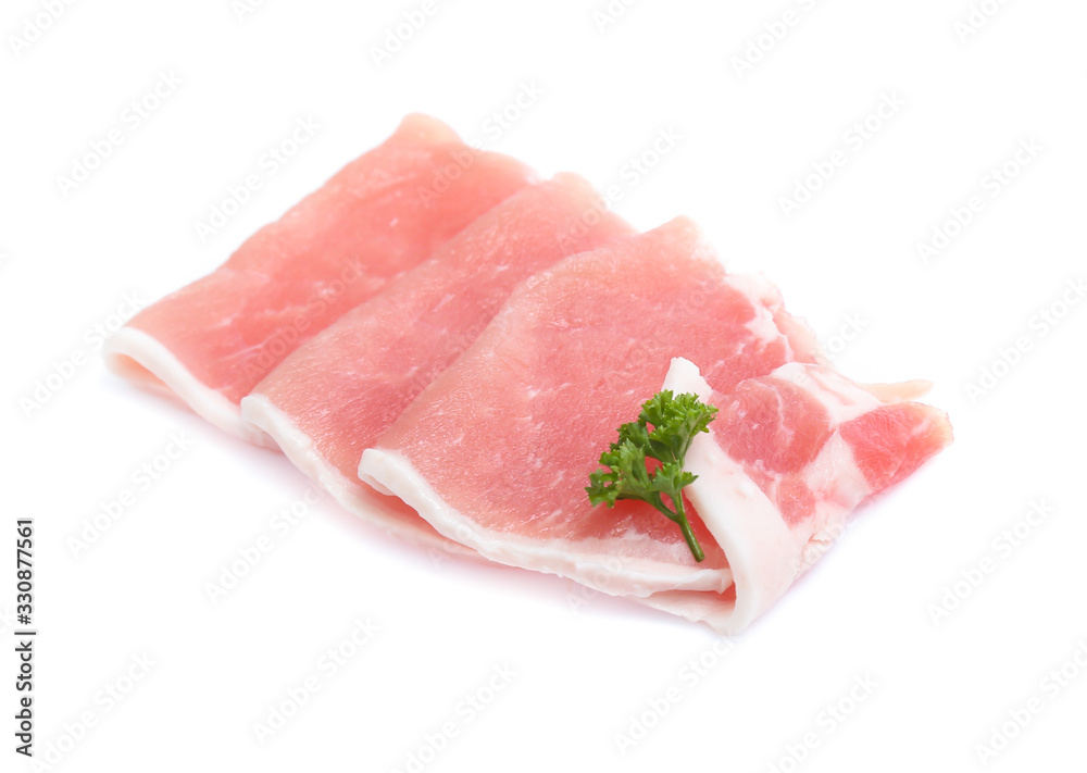 Raw pork meat with parsley herb leaves isolated on white background Raw pork meat with parsley herb leaves isolated on white background