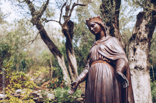 Statue of the Blessed Virgin Mary in her house exterior.