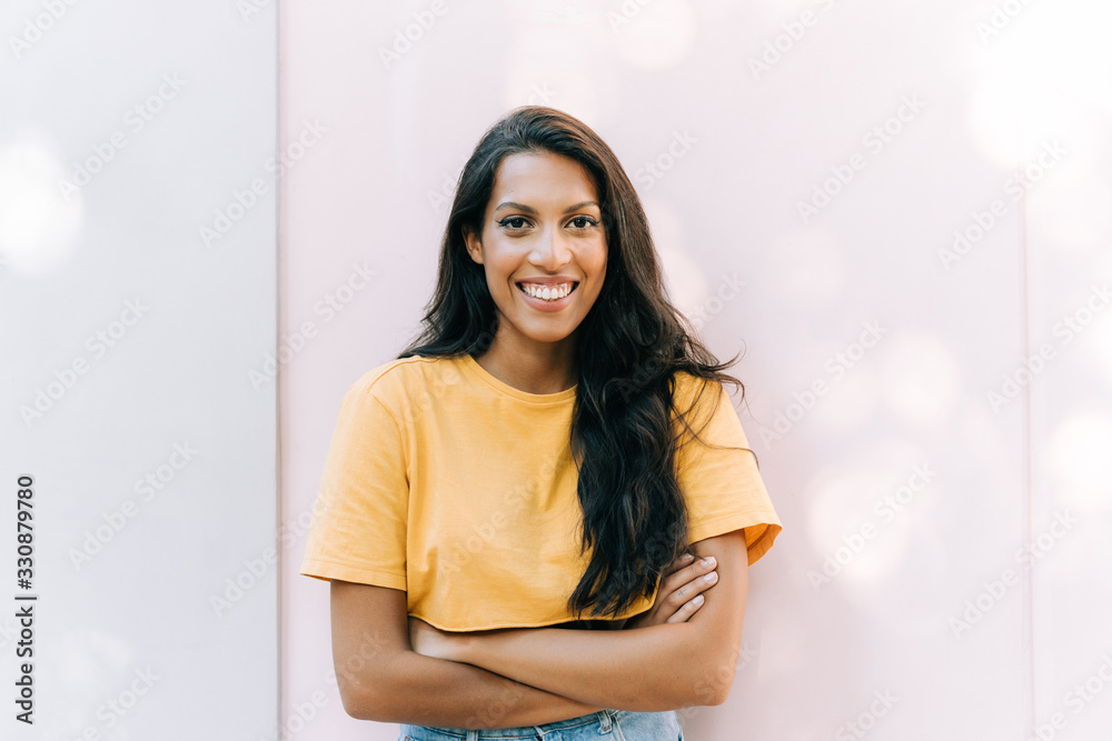 latinamerican girl smiling in front of white background latinamerican girl smiling in front of white background