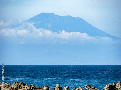 View of Mount Agung across Benoa Bay in Bali photo