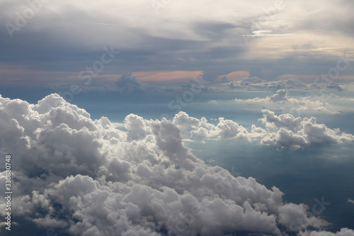 Fototapeta Naklejka Na Ścianę i Meble -  Dramatic cloudscape during sunset from the airplane's window