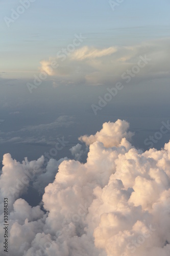 Dramatic cloudscape during sunrise from the airplane's window