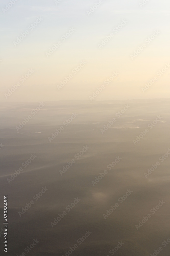 Beautiful landscape during sunrise from the airplane's window