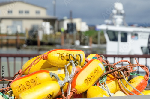 Heap of yellow lobster trap buoys photo