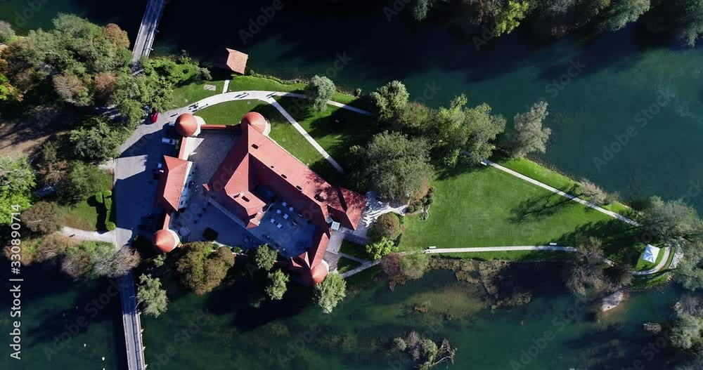 Aerial Slow Pedestal Down View Of Otocec Castle. Top Down View