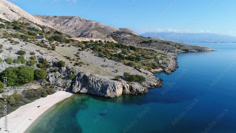 Aerial of a lovely beach hidden among mountains on Croatia coastline near Baska village Aerial of a lovely beach hidden among mountains on Croatia coastline near Baska village