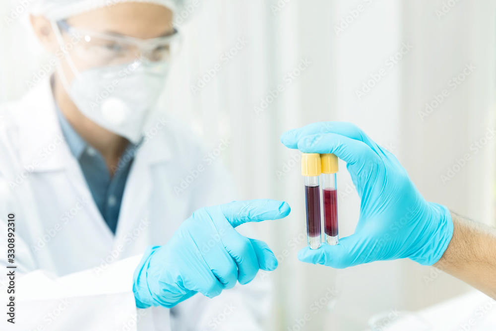 Researchers compare blood samples of patients infected with the disease in the laboratory. Researchers are inventing vaccines to treat COVID-19 virus. Researchers compare blood samples of patients infected with the disease in the laboratory. Researchers are inventing vaccines to treat COVID-19 virus.