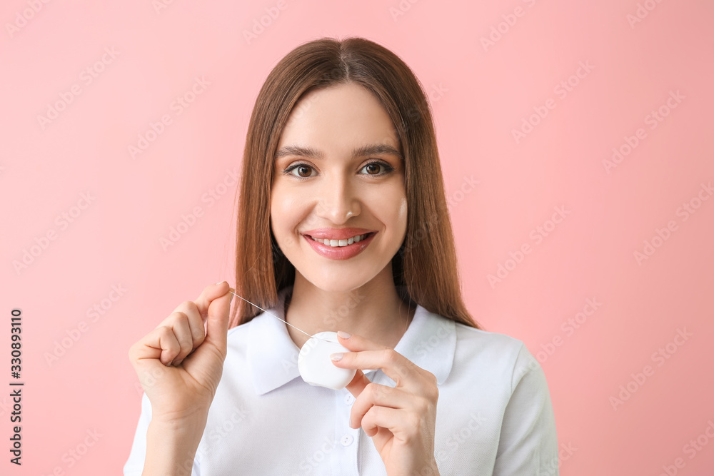 Young woman with beautiful smile and floss on color background Young woman with beautiful smile and floss on color background