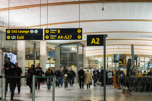 Oslo / Norway - November 30 2019: people at Gardermoen airport terminal for departure flight to travel aboard