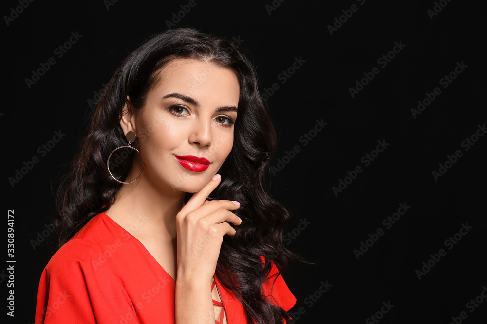 Young woman with beautiful makeup on dark background Young woman with beautiful makeup on dark background