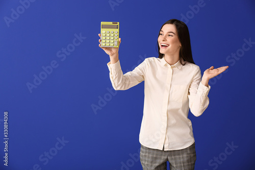 Young woman with calculator...