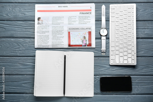 Notebook with clock, newspa...
