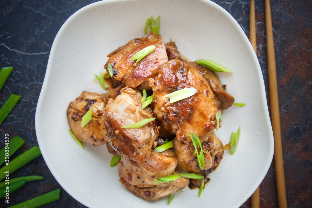 Sichuan chicken, Asian cuisine on dark background Sichuan chicken, Asian cuisine on dark background