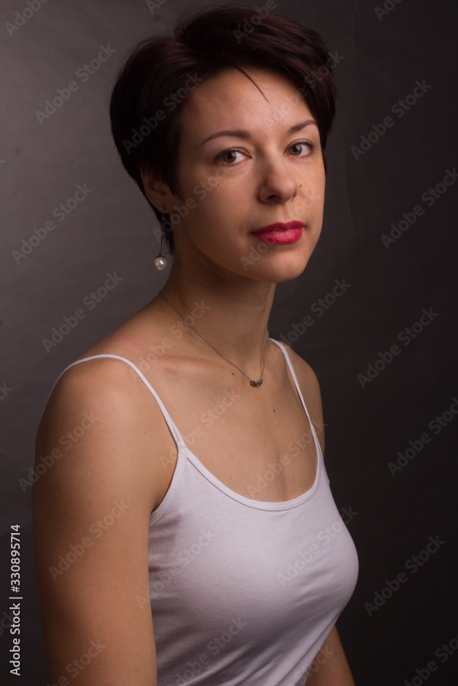 brunette with short hair. Studio portrait white t-shirt. brunette with short hair. Studio portrait white t-shirt.