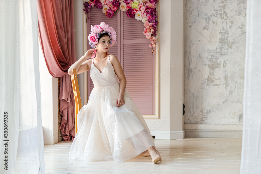 Fototapeta premium beautiful smiling girl with flowers in her hair