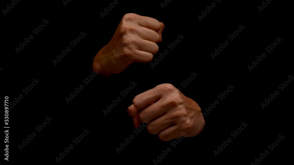 Male hands showing gesture isolated on black background Male hands showing gesture isolated on black background