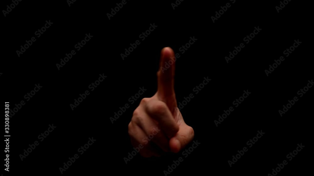 Male hand showing gesture isolated on black background Male hand showing gesture isolated on black background