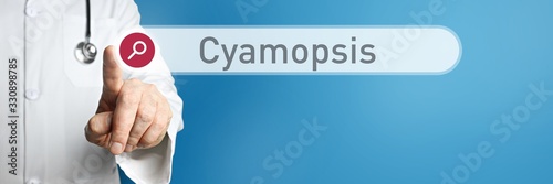 Cyamopsis. Doctor in smock points with his finger to a search box. The word Cyamopsis is in focus. Symbol for illness, health, medicine photo