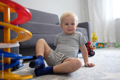 Dad plays with his son in the nursery