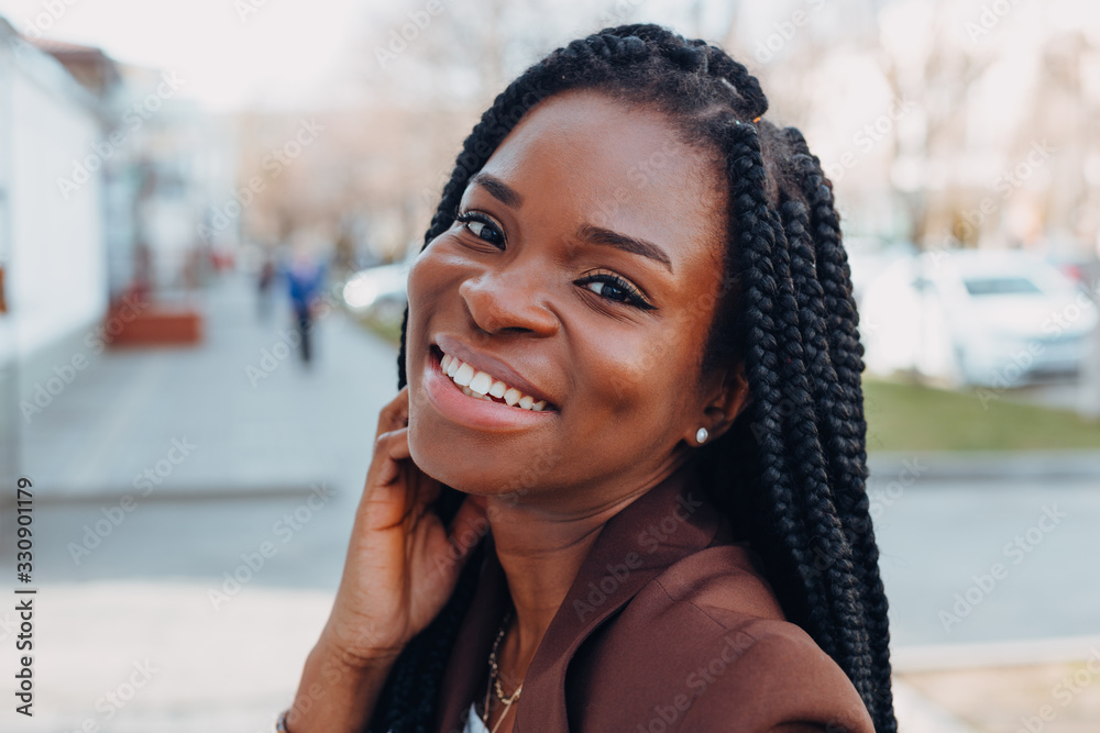Close Up Portrait of a Beautiful Young African American Woman with Pigtails  Hairstyle in a Brown Business Suit Walks Along Spring Stock Photo - Image  of casual, model: 176243446