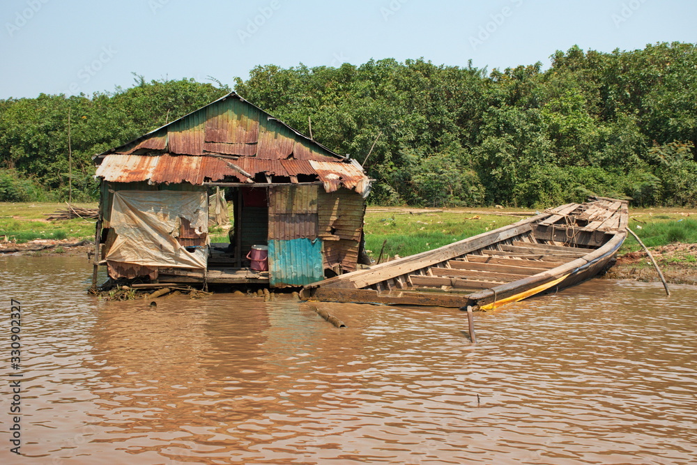 Traveling by boat on Tonle Sap lake along the fishing village Komprongpok Traveling by boat on Tonle Sap lake along the fishing village Komprongpok