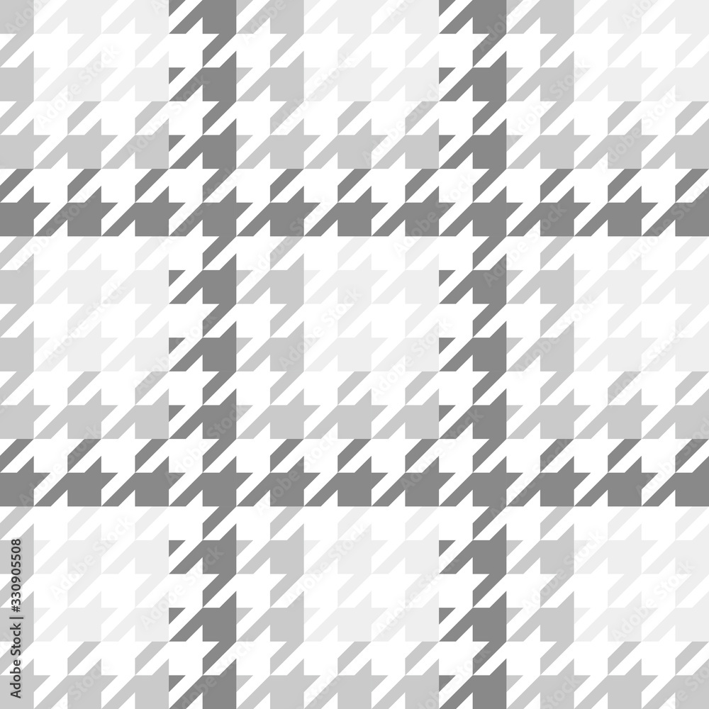 Vector image of a large houndstooth pattern with a gradient gray color scheme. Vector image of a large houndstooth pattern with a gradient gray color scheme.