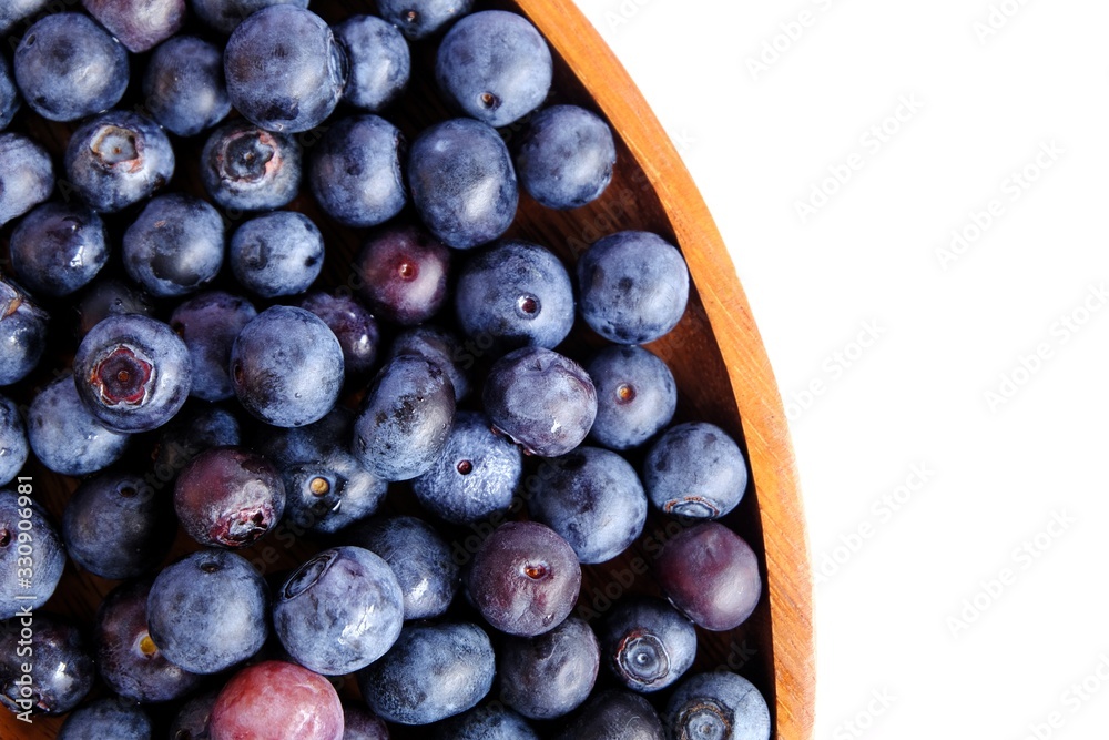 Fototapeta premium fresh blueberries on wood isolated on white background. Selective focus.