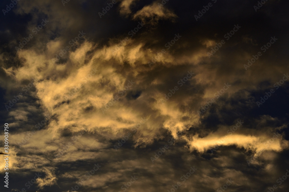 Blue sky with gold clouds