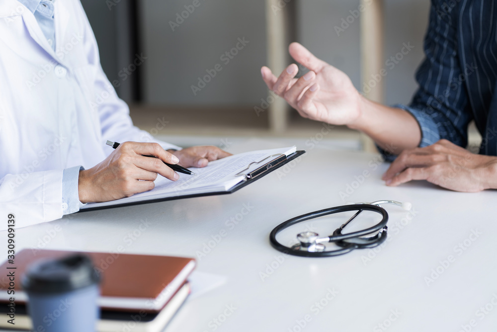 Doctor with patient in medical clinic or hospital..