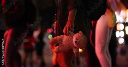 women is enjoying and carrying toy bear at lunapark