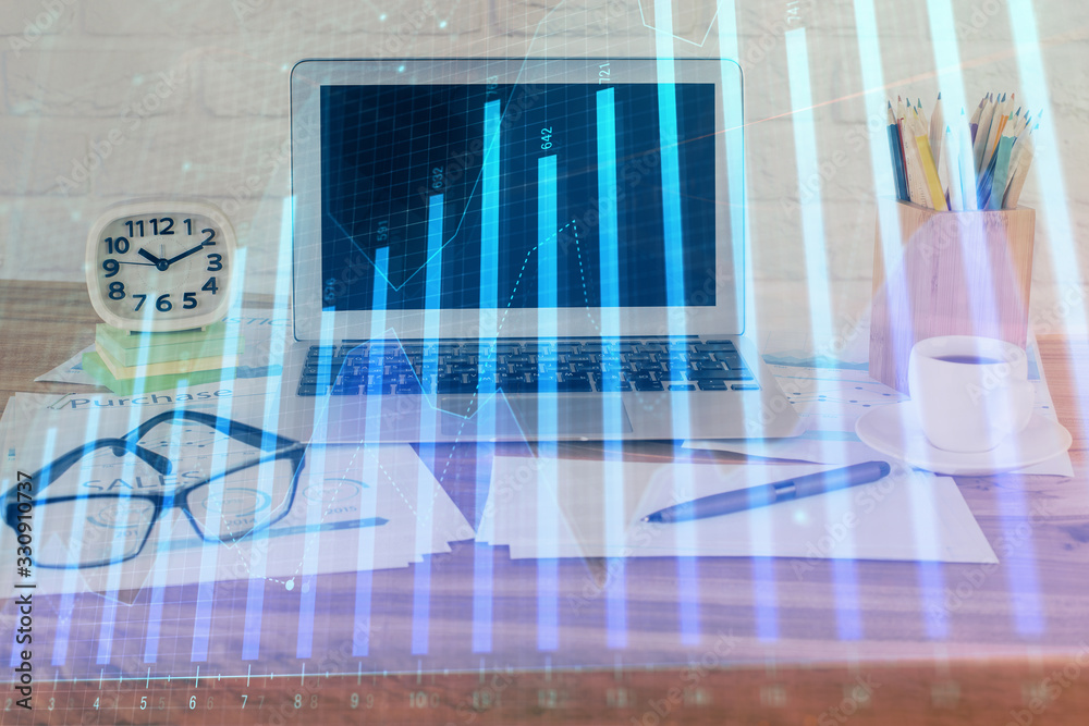 Forex market graph hologram and personal computer on background. Multi exposure. Concept of investment. Forex market graph hologram and personal computer on background. Multi exposure. Concept of investment.