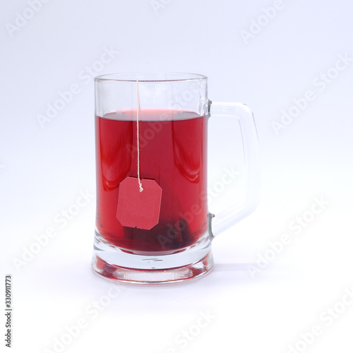 Red Tea glass cup with tea bag. Tea cup isolated on white background.