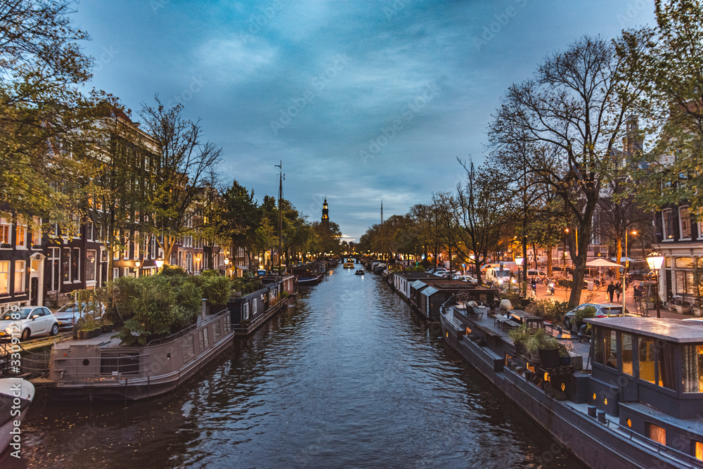 cityscape of a canal in amsterdam