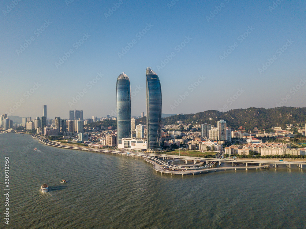 Aerial view of Xiamen cityscapes, skyline and the bridge with beautiful seascape during the sunset, Fujian China