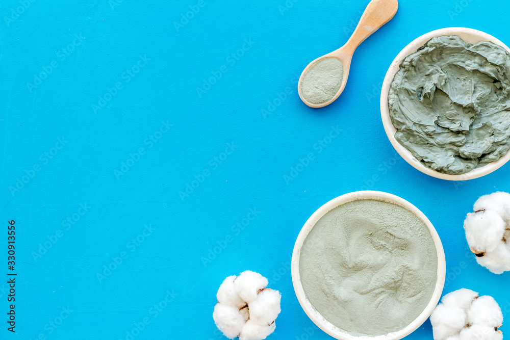 Blue cosmetic clay on blue background top-down copy space Blue cosmetic clay on blue background top-down copy space