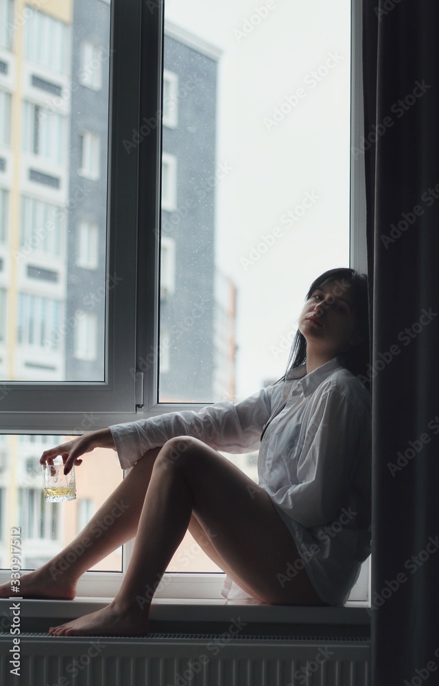 Attractive caucasian brunette girl at home, emotional portrait