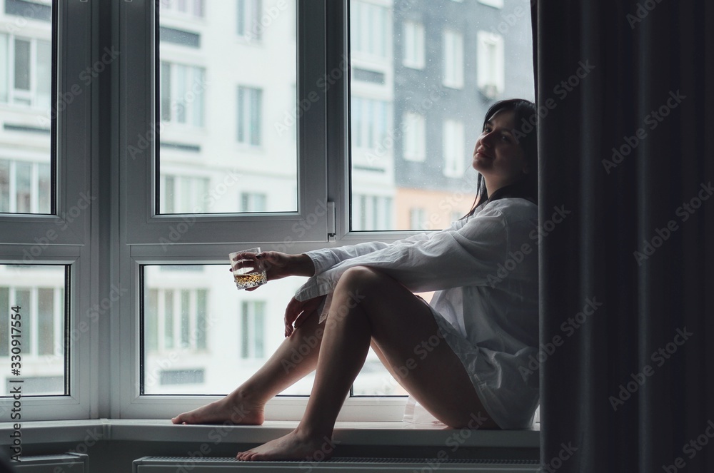 Attractive caucasian brunette girl at home, emotional portrait